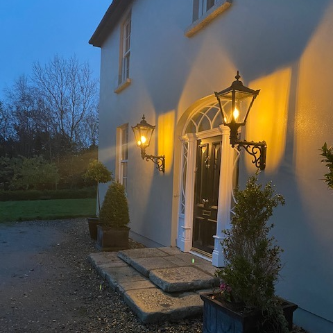 Victorian traditional cast iron wall light with decorative arm