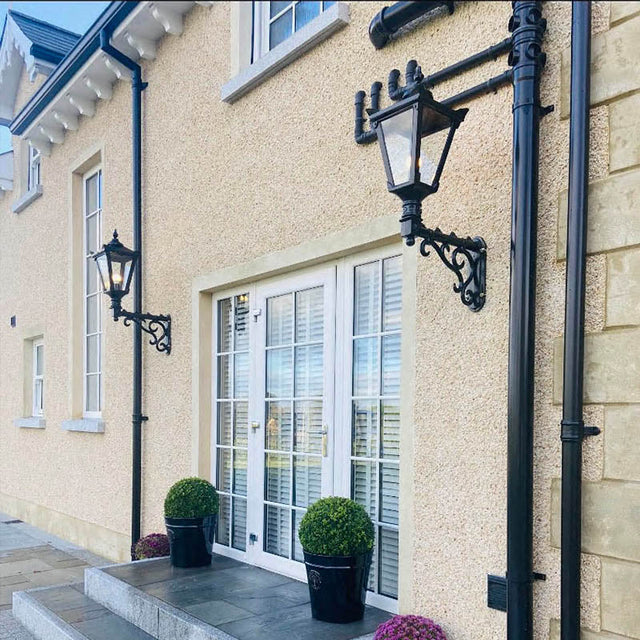 Victorian traditional cast iron wall light with decorative arm