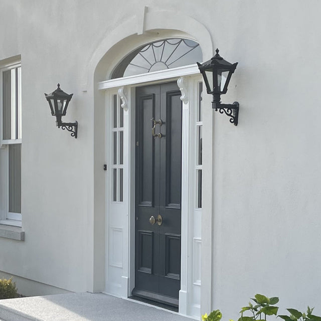 Victorian traditional cast iron wall light with decorative arm