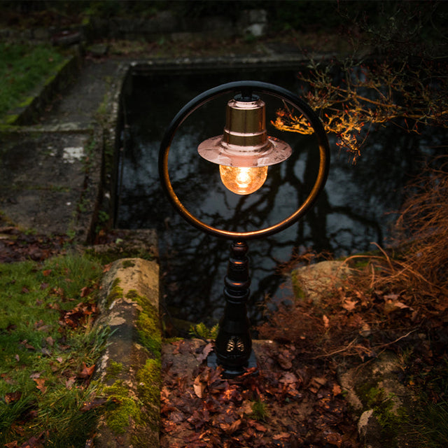 Copper railway style pedestal light in cast iron