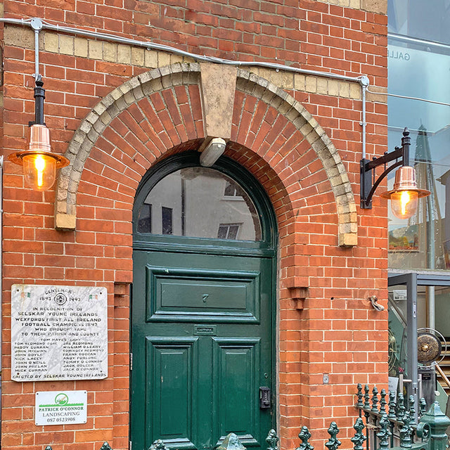 Copper railway style wall light in cast iron and steel