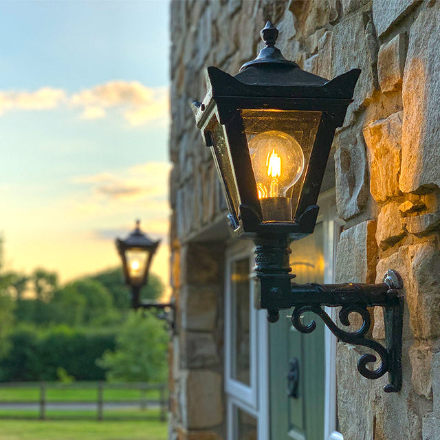 Victorian traditional cast iron wall light with decorative arm