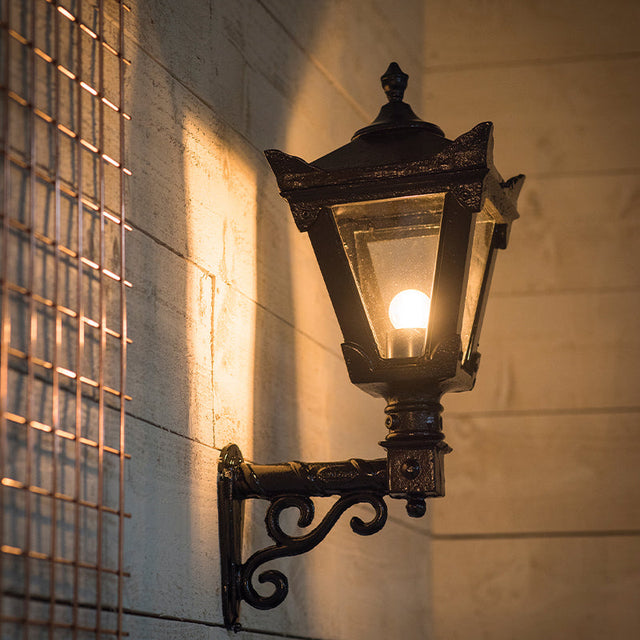 Victorian traditional cast iron wall light with decorative arm